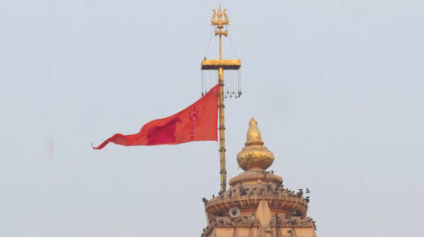 The significance of 'Dhwaja' or flag on the top of a temple