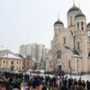 Navalny's open casket and family's lit candles