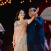 Mukesh Ambani and his wife Nita Ambani dancing on stage