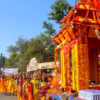 Devotees participate in procession