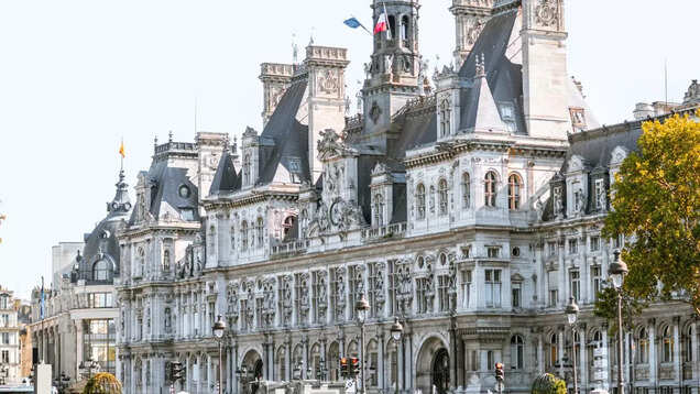 French police removes migrants staying near the iconic Paris City Hall ahead of Olympics