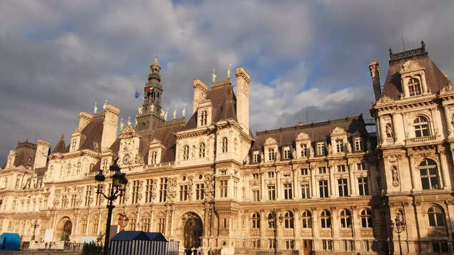 French police removes migrants staying near the iconic Paris City Hall ahead of Olympics