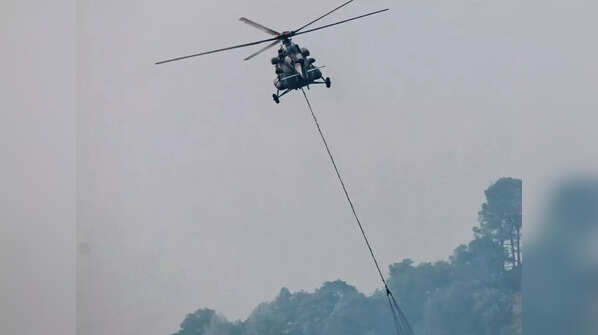 IAF helicopter ropes in to douse forest fire