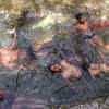 Children ​take bath to beat the heat
