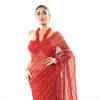 Article image for: <i class="tbold">raveena</i> Tandon sets the temperature soaring in red saree made with recyclable material