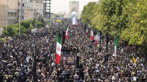 Tens of thousands gather for Raisi funeral procession in Tehran