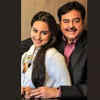 Shatrugan Sinha and Sonakshi hugging to the side, hands wrapped together