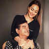 Sonakshi Sinha’s head tilted against Shatrugan Sinha's 