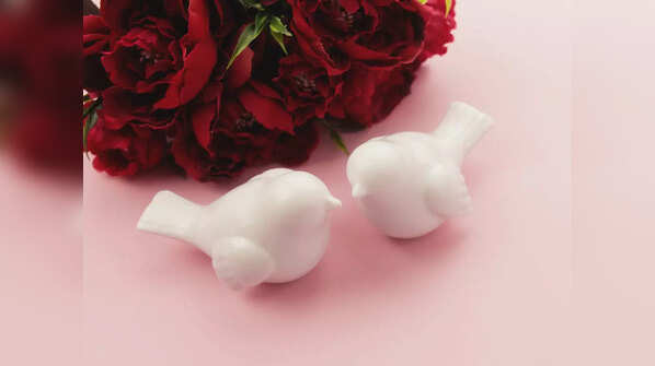A pair of white bird sculptures