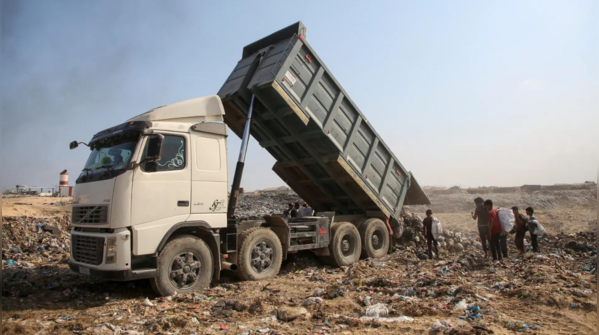 Truck unloads garbage