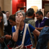 Passengers waiting for information on display boards