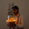 Article image for: Ghee diya near <i class="tbold">tulsi plant</i>
