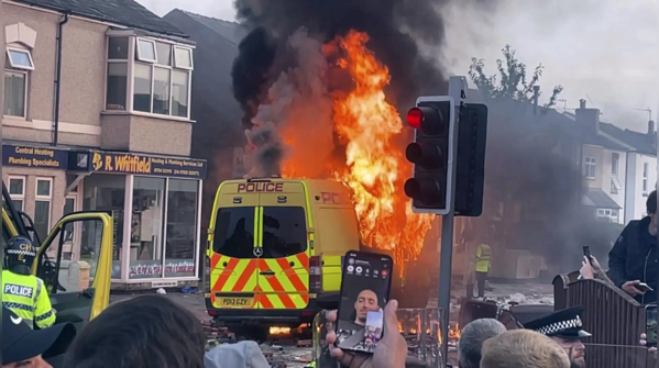 Police vehicles set ablaze