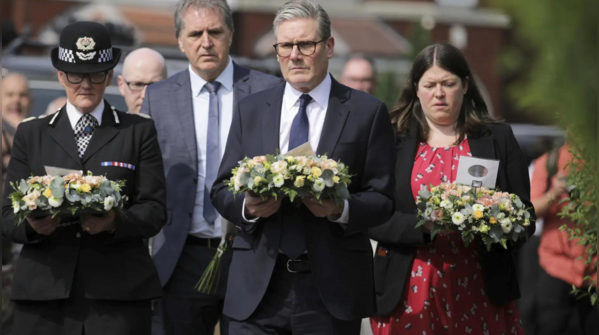 UK PM arriving to pay tribute