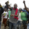​Protesters chant songs