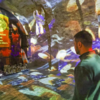 ​Standing silent before memorial wall of toys