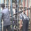 Civic workers grease-check gates ahead of the protest​