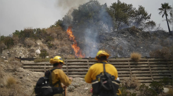 Hundreds of firefighters battle the blaze