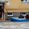 Rescuers assist flood-stricken residents