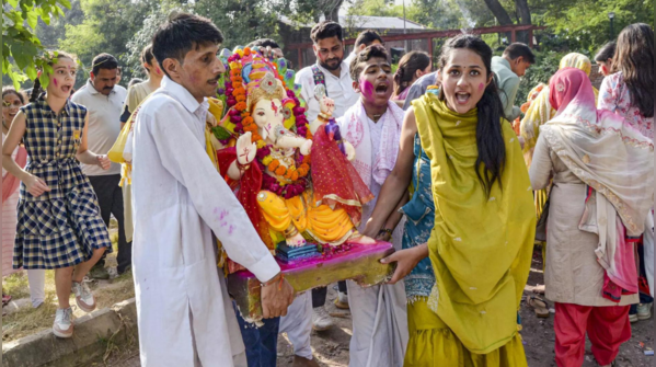 People immerse Ganesh idols in water bodies