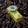 Mourners carrying the coffin