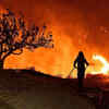 Two dead as wildfire threatens communities