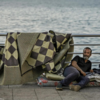 Man resting on corniche