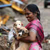 Manjula, a resident of Ganeshapuram who feeds the stray puppies, came to check on them after the rains.