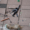 ​A gun lay amid debris in the outdoor lounge area