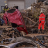 Rescue tams race to clear flood debris