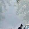 City latest News Today Live: A pedestrian crosses Mandir Marg, where the AQI measured 382 at 12.00pm. Delhi was engulfed in smog on Monday as the air quality dropped into the 'very poor' category in many areas.