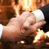 Handshake before fire to cool down political temperature
