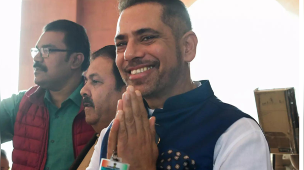 Joined by mother Sonia, brother Rahul, and husband Robert Vadra