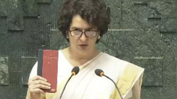 Held constitution in hand, took oath in hindi