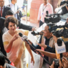 Arrives at Parliament, says, 'I am very happy today'"