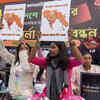 Demonstrators carry signs urging UNHRC to intervene 