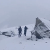Residents navigate snow-covered paths