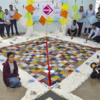 Students pose with large kite