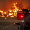 Residents sprayed property amid fire