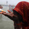 Maha Kumbh 2025: A woman devotee offers prayers after taking the holy dip at Sangam.
