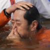 Article image for: Bhutan king takes <i class="tbold">holy dip</i>