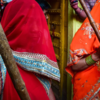 Women armed with 'lathis'