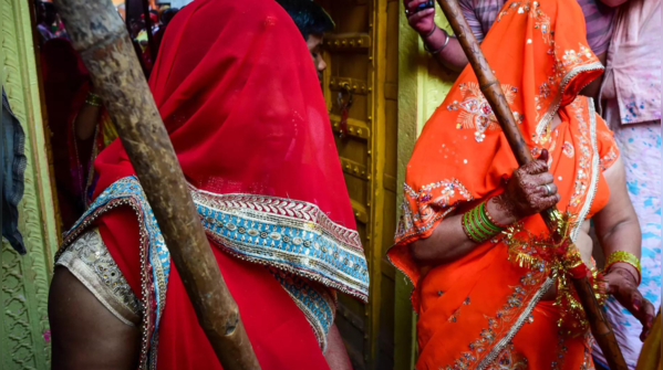 Women armed with 'lathis'