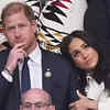 Meghan leans her head against his shoulder