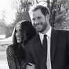 Meghan holds Harry's arm