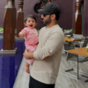 Little Navya all amazed in father’s arms