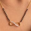 Infinity design with gold and diamond detailing