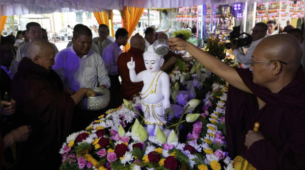 Buddha’s childhood statue bathed in devotion in Yangon