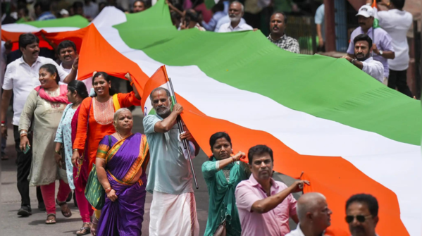 Citizens carry giant National Flag in Bengaluru Tiranga Yatra