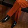 People who cross their legs as soon as they sit down